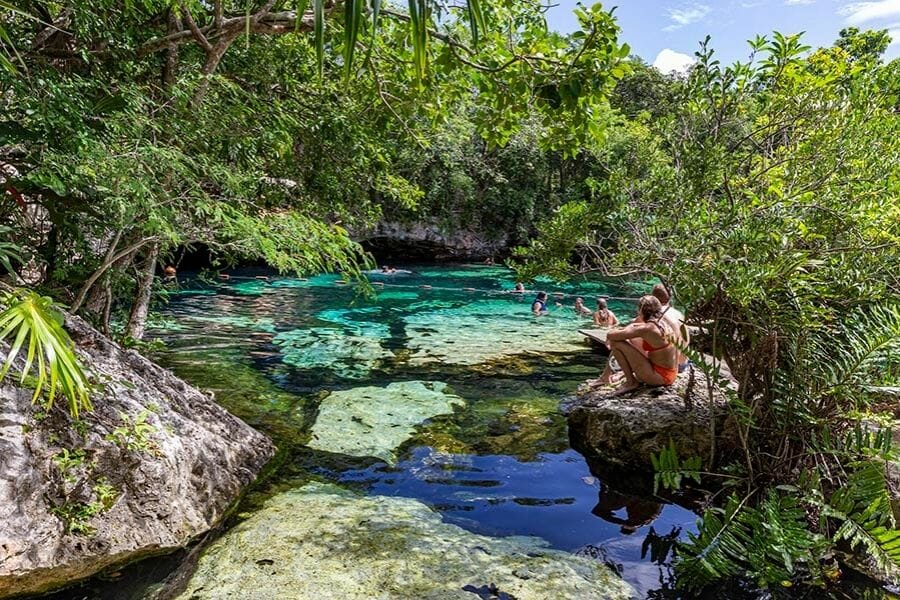 Cenote azul couple sitting