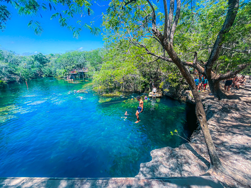 Guy Jumping from Cenote Eden